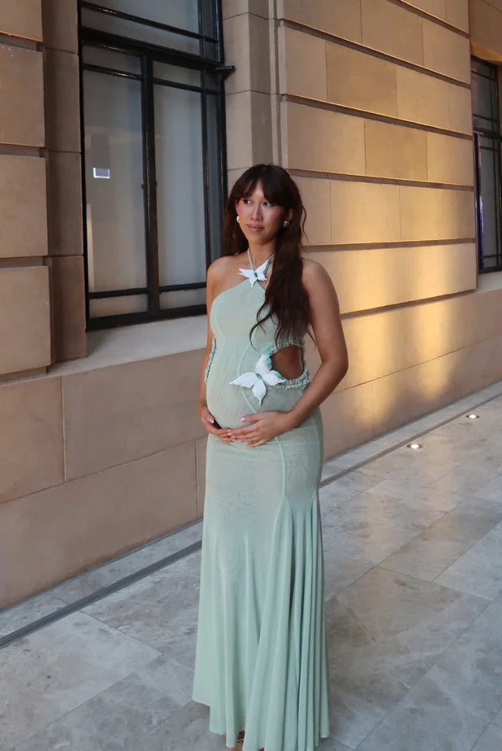 "Estefani mint green mermaid-fit maxi dress with halter neck, perfect for a glamorous yet comfortable look."