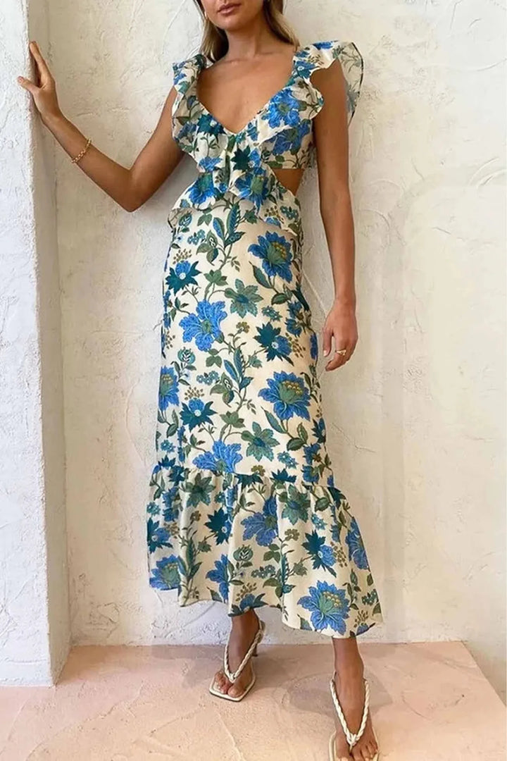 "Kaelynn midi dress featuring a feminine floral print and V-neckline with ruffle details in a soft and flowy fabric."