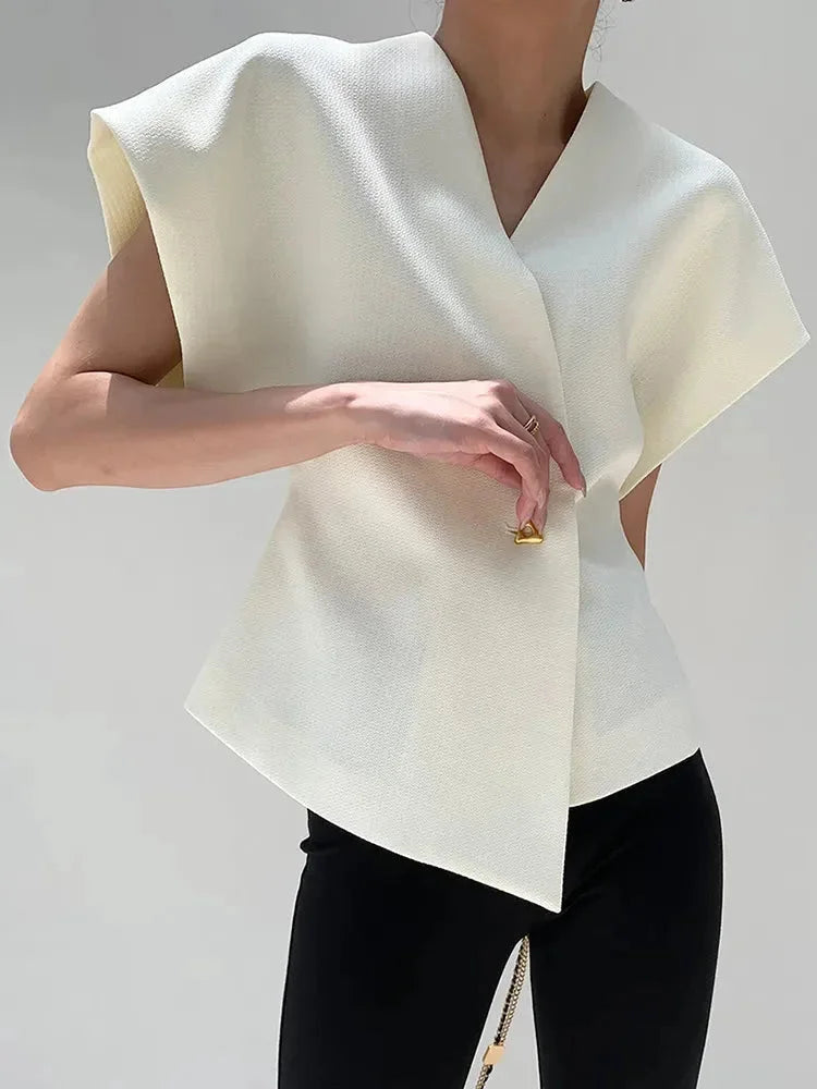 "Landrie wrap-style blouse in red crepe fabric with sculpted sleeves and elegant design"