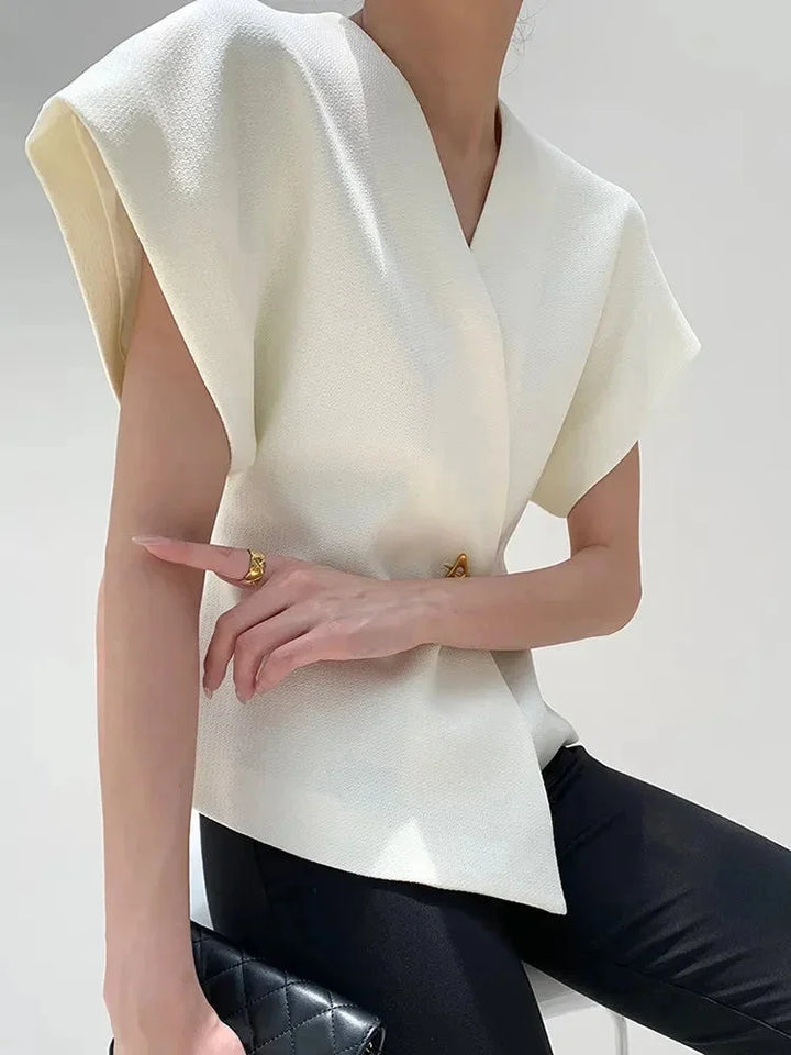 "Landrie blouse in a wrap style with sculpted sleeves, chic and modern design in soft and flowy fabric"