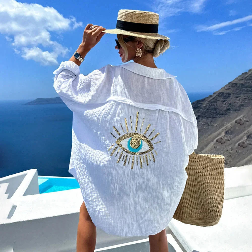 White oversized blouse with eye motif design for women by Jailyne. Features a breezy style perfect for casual occasions.