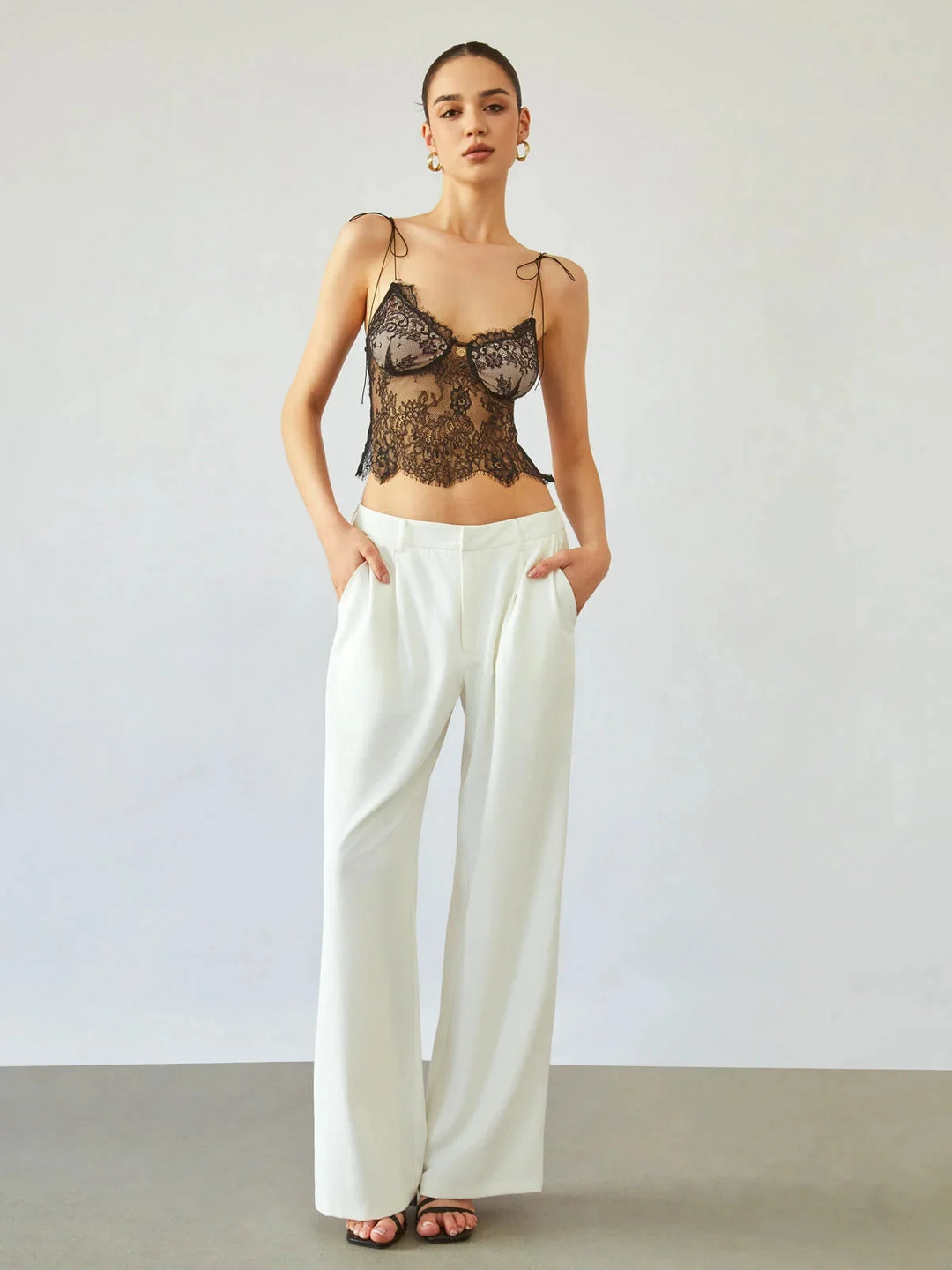 "Lynnox lace camisole top in white, adjustable straps, floral lace design, ideal for layering or standalone wear."