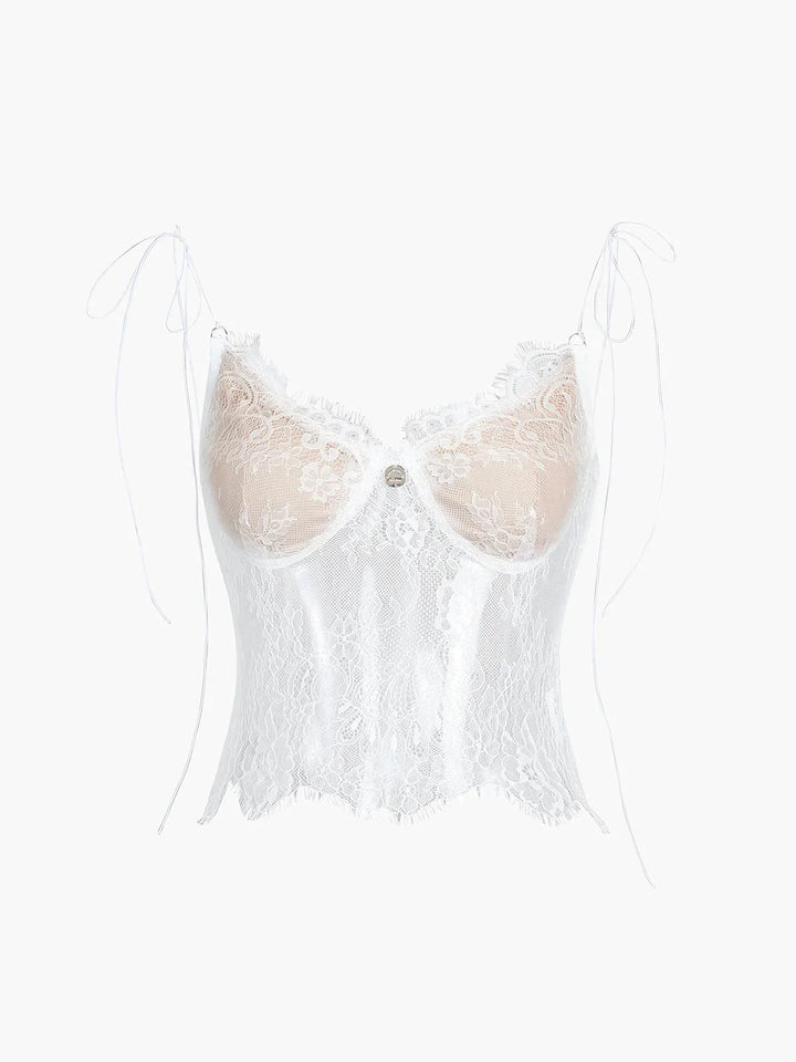White lace camisole top with adjustable straps by Lynnox. Feminine and delicate design perfect for layering or wearing on…