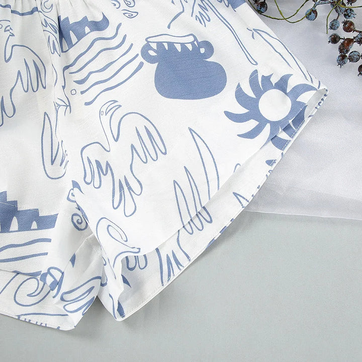 Harleigh white and blue patterned set featuring intricate geometric design, crafted in soft cotton blend for all-day comfort.