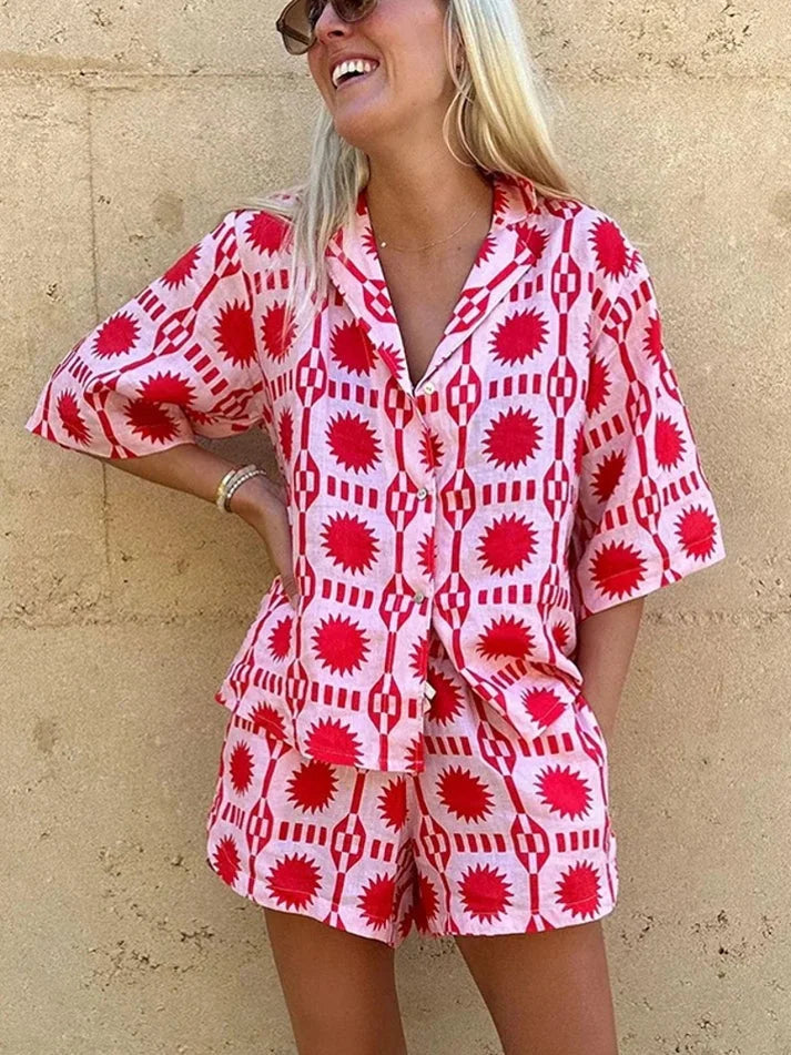 Pink short-sleeve shirt and shorts set by Majesty. Made of soft cotton blend, featuring a polka dot design and front pockets.