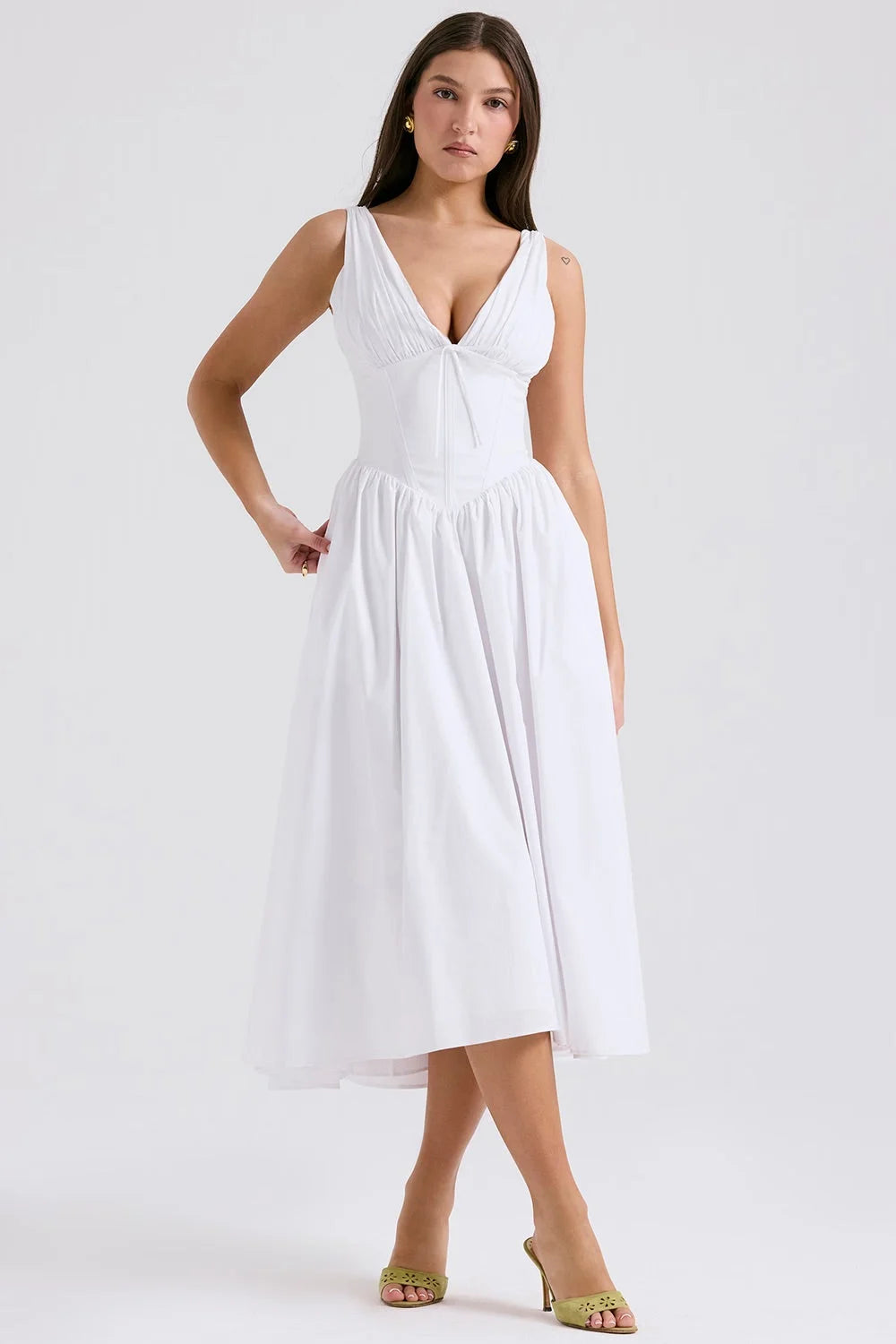 White floral midi dress with v-neckline made from lightweight cotton blend. Perfect for a casual day out or a summer…