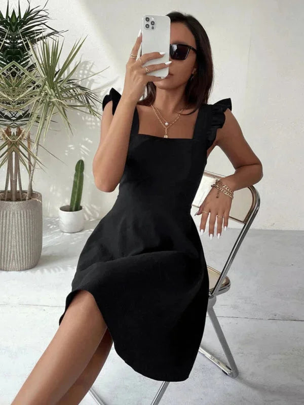 Viviane flared mini dress in navy blue with ruffle detail, made of soft cotton blend, perfect for casual outings or daytime…