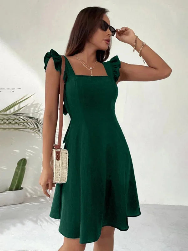 "Viviane flared mini dress in black with ruffle detail, perfect for casual outings or special occasions."