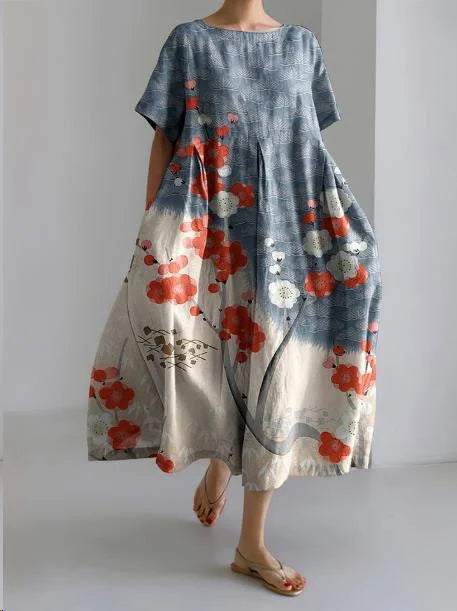 "Precious relaxed-fit dress in Colorful Flowers featuring a vibrant flower pattern design, made from soft and breathable fabric."
