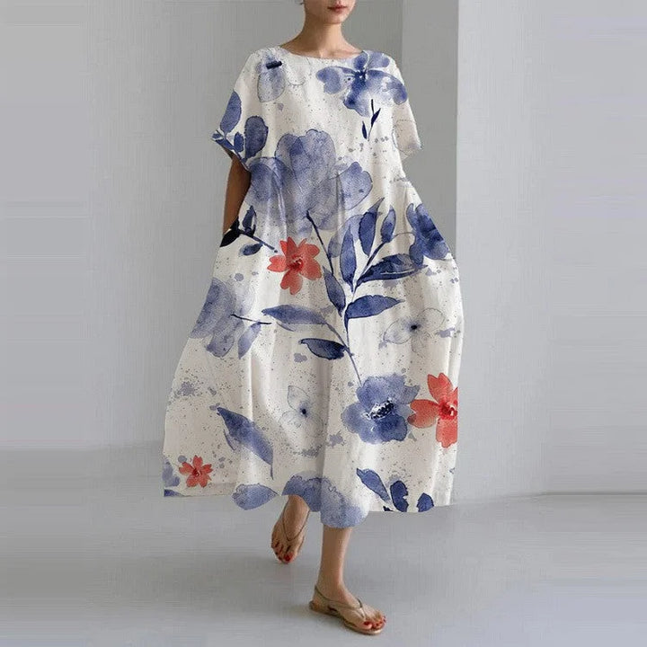 "Precious relaxed-fit dress in Watercolour Flowers with delicate floral pattern, flowing silhouette, and soft fabric."
