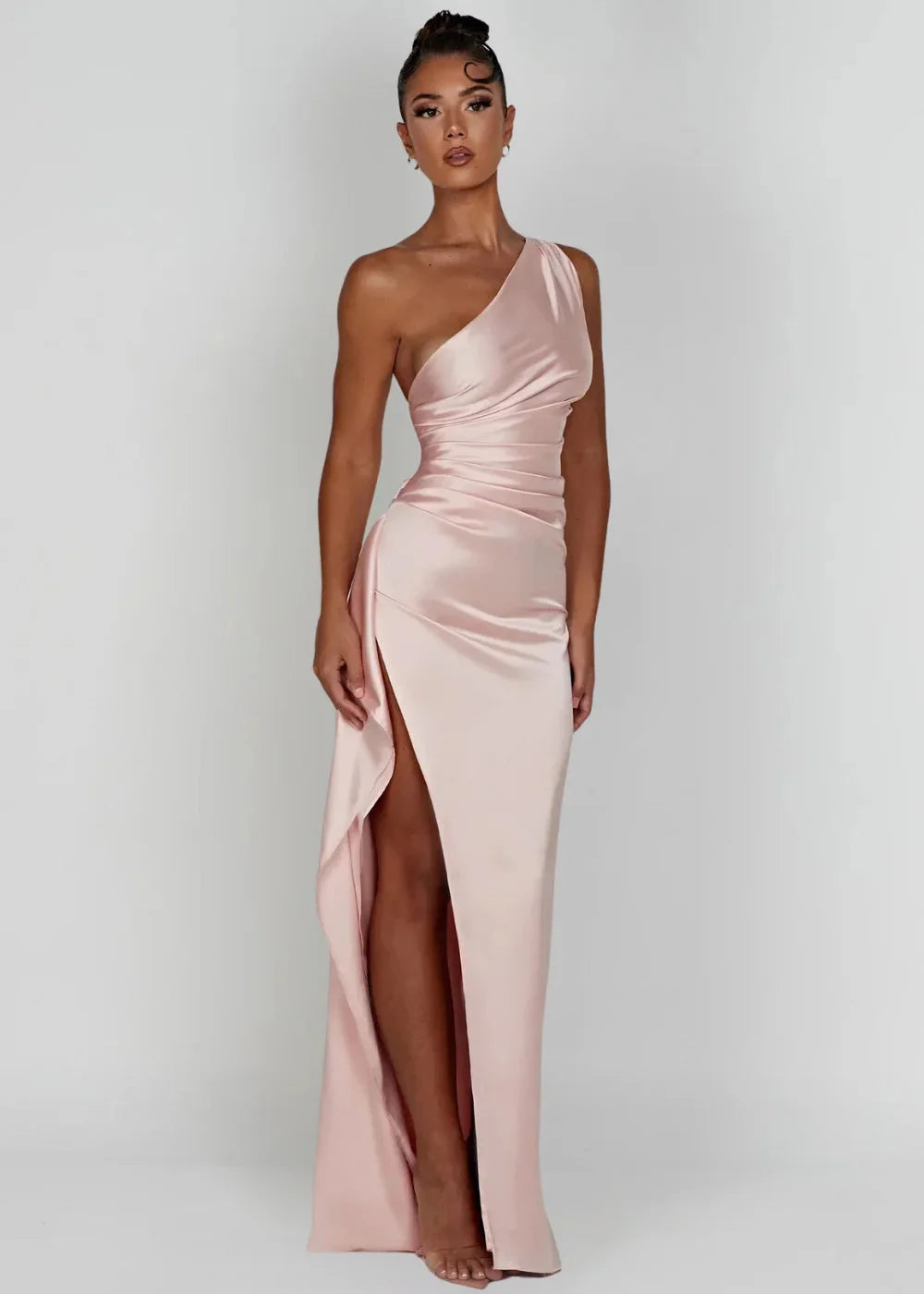 Pink Dottie satin dress with one-shoulder design and slit detail. Silky smooth fabric for a sophisticated evening look.