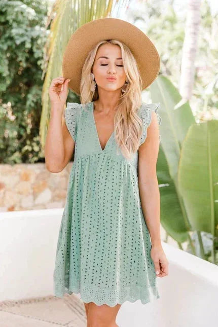 Light green sleeveless lace dress with side pockets by Hala. Delicate lace detailing and convenient pockets for a…