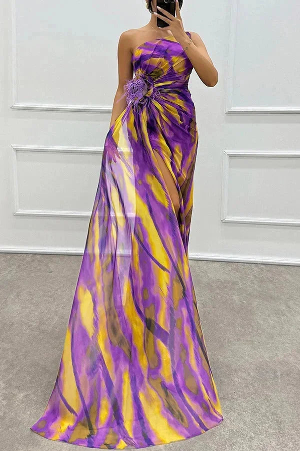 "Lilyanne maxi dress featuring bold floral pattern, side slit, and v-neck. Made with soft and flowy fabric for a stylish summer…