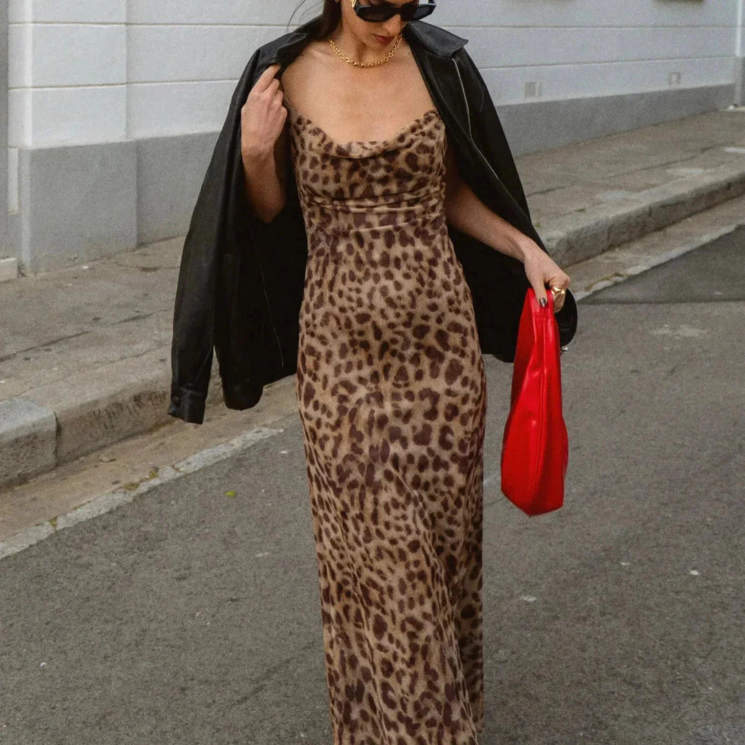 "Animal print slim-fit maxi dress by Edith, featuring a fierce and stylish design, perfect for adding some wild flair to…