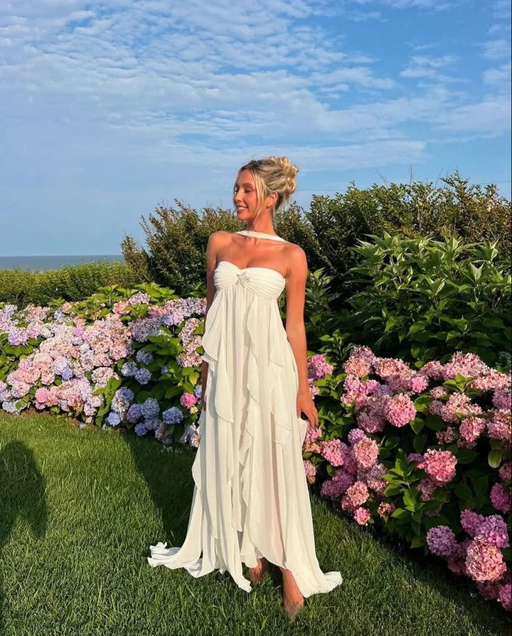 Strapless dress with elegant ruffles in black satin fabric perfect for special occasions.