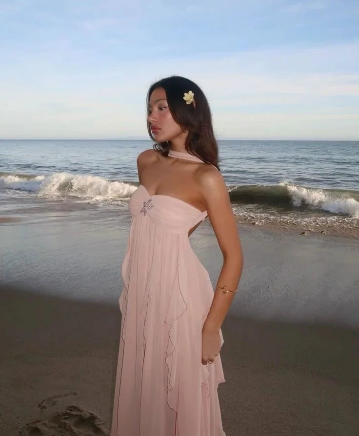Pink strapless dress with delicate ruffles, perfect for a special occasion. Made from soft and flowy fabric, exudes elegance…