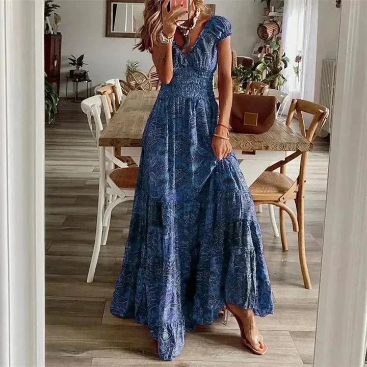 "Bree dress in earthy tones, with tiered skirt, sleeves, and intricate boho design, perfect for a casual day out."