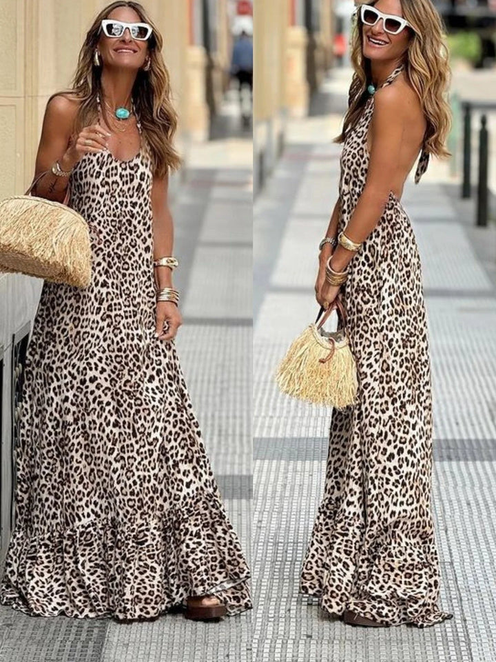 Sleeveless leopard print maxi dress featuring a flowy silhouette and bold animal print pattern, perfect for a chic and…