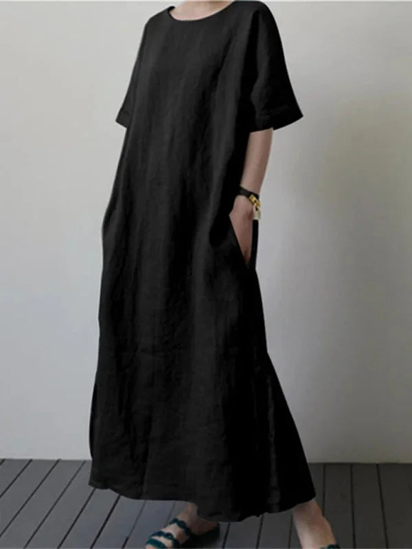 "Nori long dress featuring adjustable tie waist, made with soft flowing fabric in a sleek and elegant design."