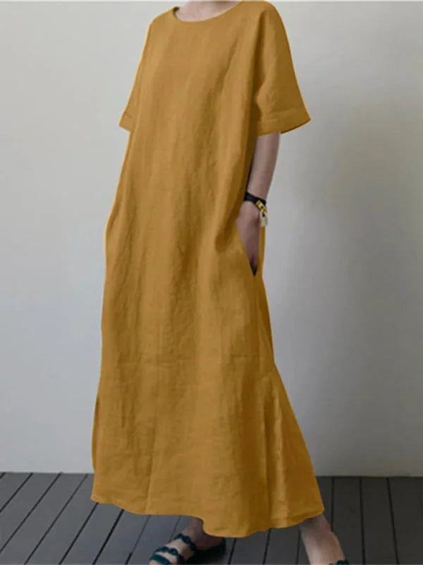 "Nori long dress in soft cotton blend with adjustable tie waist, draped design, and a sophisticated silhouette."