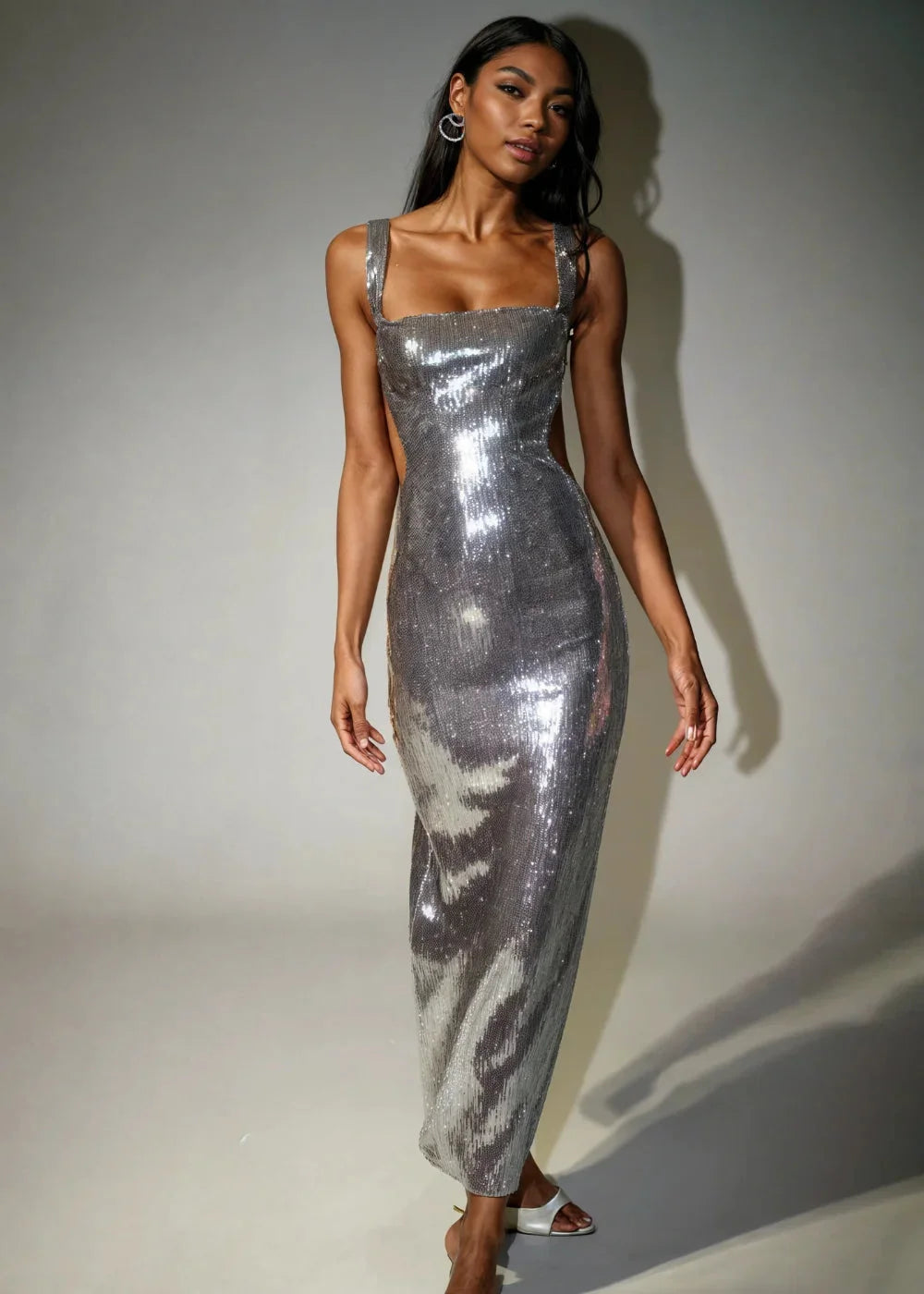 Sleeveless metallic Stormy sequin dress, perfect for adding glam to your outfit, features a flattering silhouette and…
