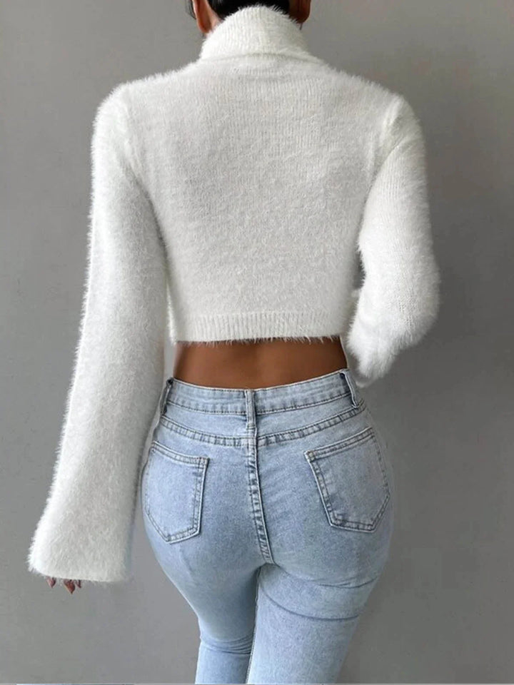 "White cropped turtleneck sweater with fluffy texture, perfect for winter layering"