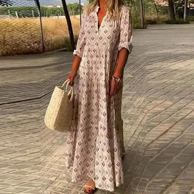 "Judith maxi dress in a flowy design with a v-neck, perfect for effortless and comfortable styling."