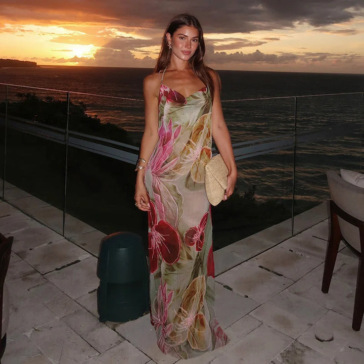 "Olyvia sleeveless dress featuring a vibrant floral design on woven cotton fabric"