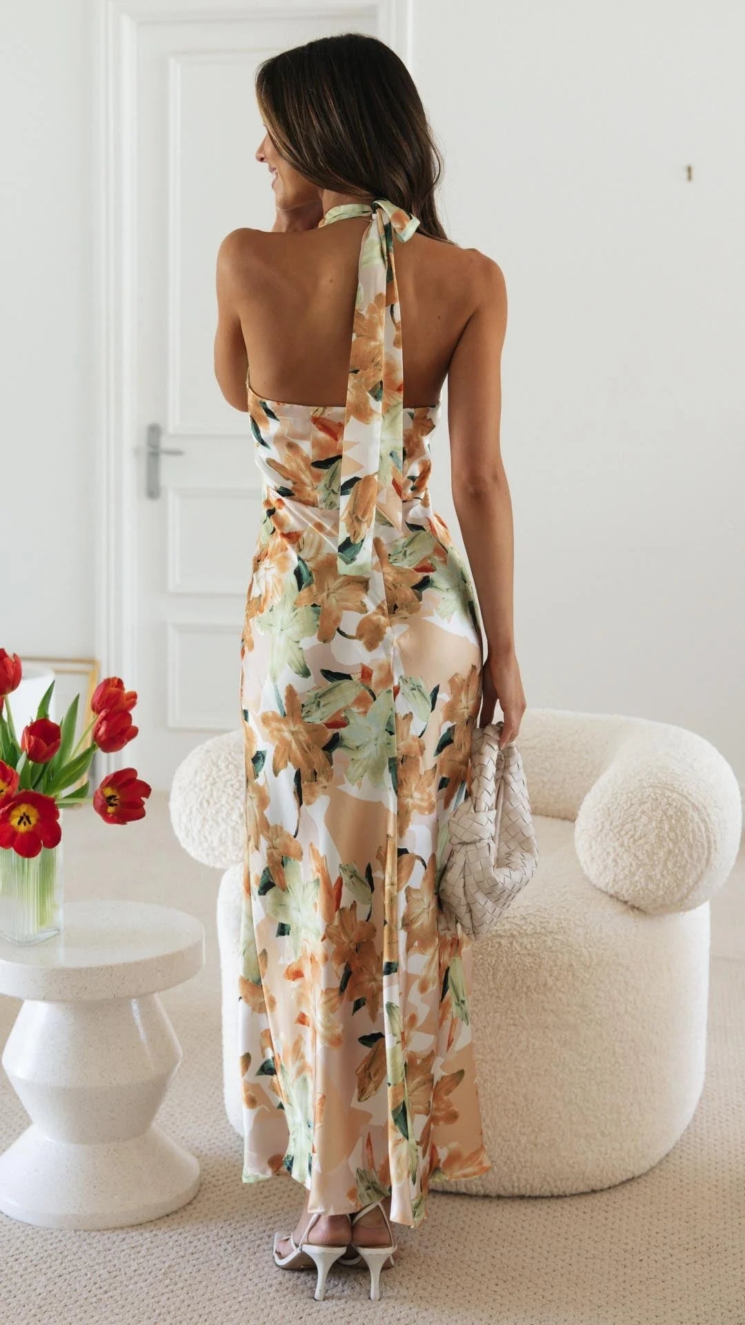 "Nayah halter maxi dress featuring a floral pattern, perfect for a breezy sunny day out."