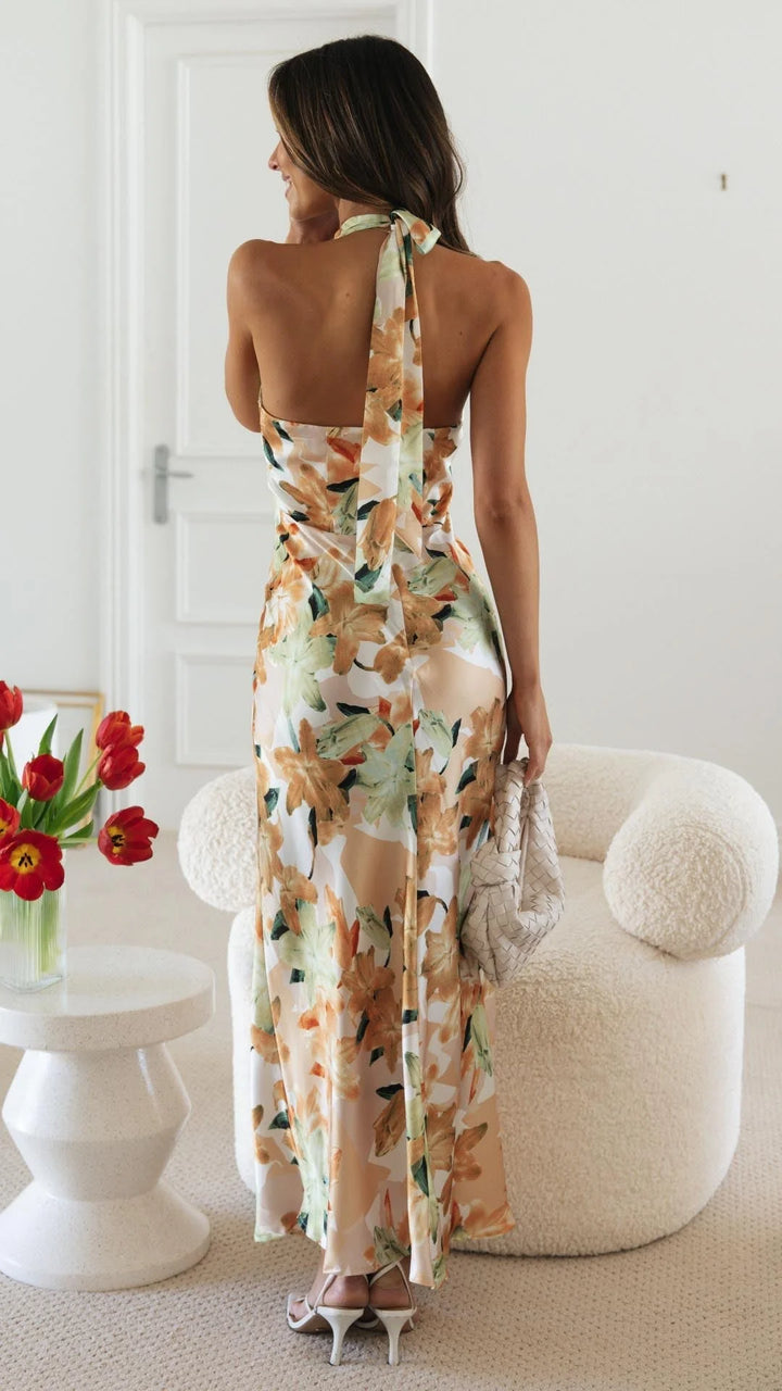 "Nayah halter maxi dress featuring a floral pattern, perfect for a breezy sunny day out."
