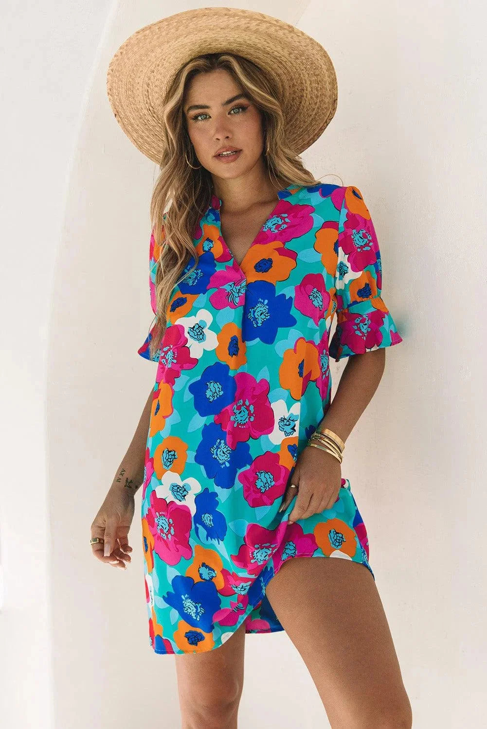 "Adria shift dress with V-neck and floral pattern, made in soft cotton blend, perfect for casual outings or gatherings."