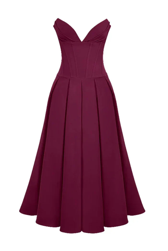Strapless A-line midi dress in Camryn design, featuring a corseted bodice. Made of lightweight, flowy fabric in a versatile…