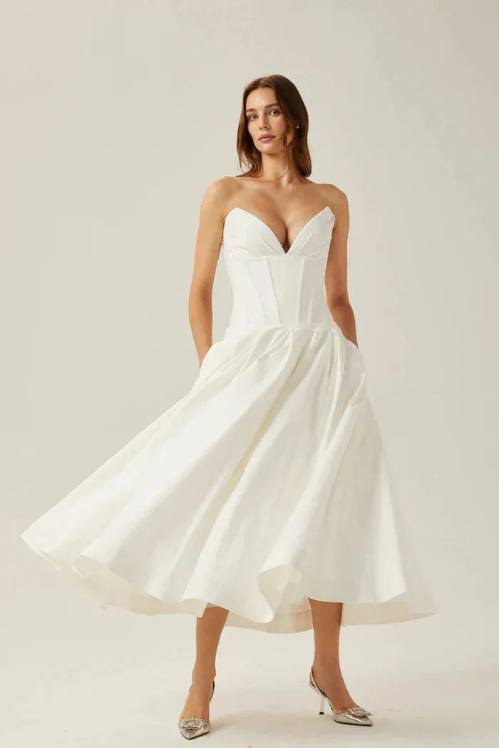 Strapless A-line midi dress by Camryn with corset detailing, perfect for a stylish and sophisticated look.