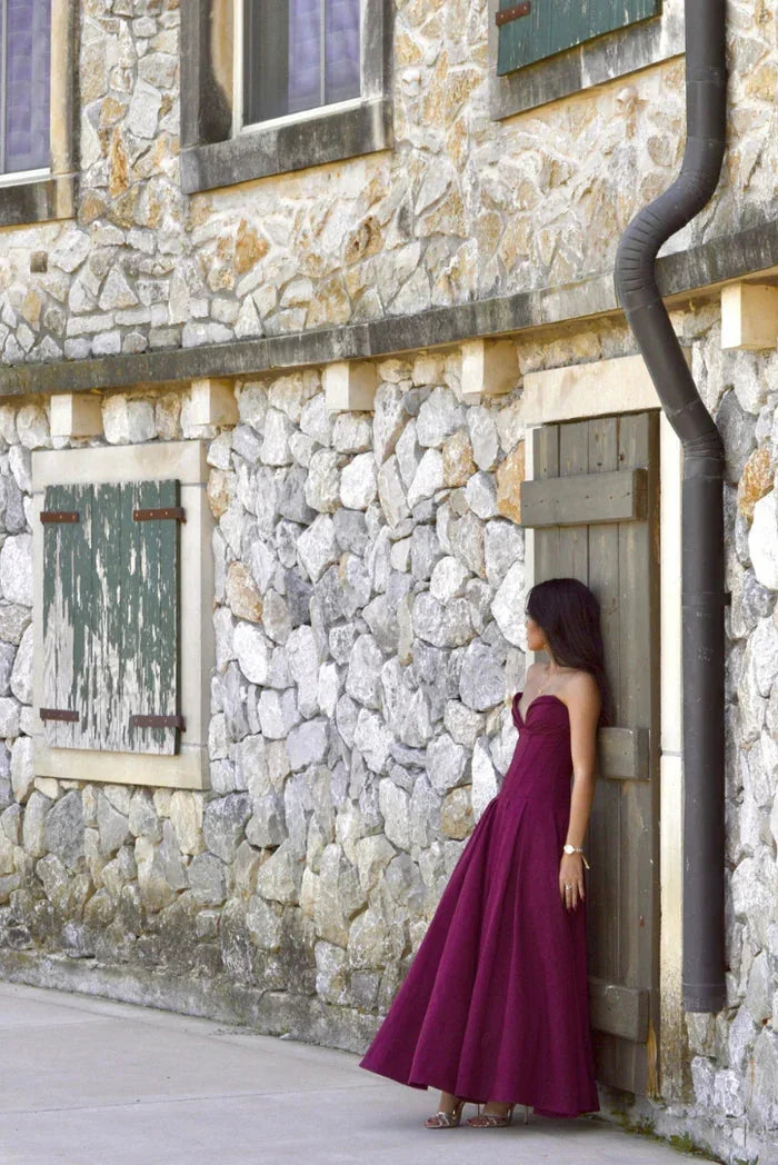 Strapless A-line midi dress by Camryn with corset detailing, perfect for a chic and modern look.