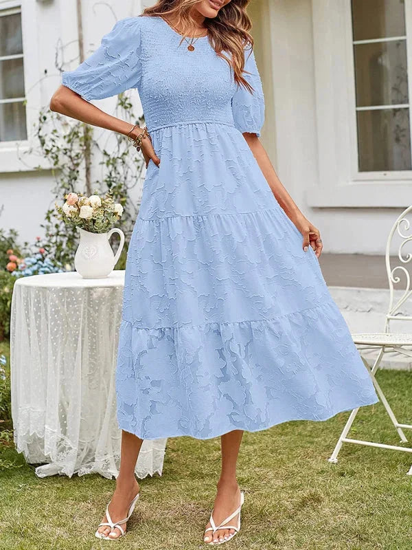 "Floral textured tiered midi dress by Emily, featuring a soft and flowy fabric with intricate floral pattern and tiered…