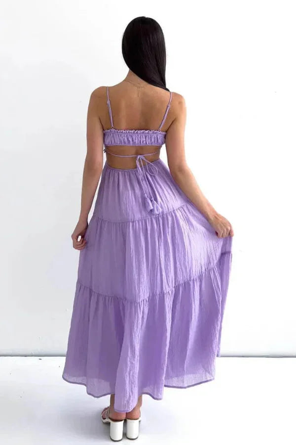 Tiered maxi dress made of flowy fabric with an elegant design named Jaela, perfect for a stylish woman's wardrobe.