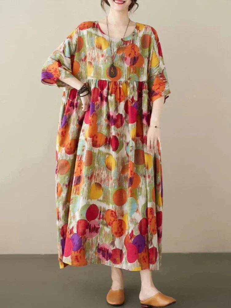 Red boho maxi dress with artistic prints featuring a flowy silhouette. Made with soft, breathable fabric for a comfortable…
