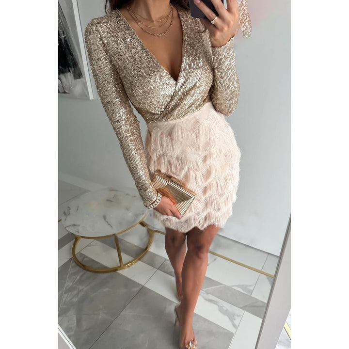 Beige sequin top feather skirt dress showcasing intricate sequin detailing and delicate feathered skirt.