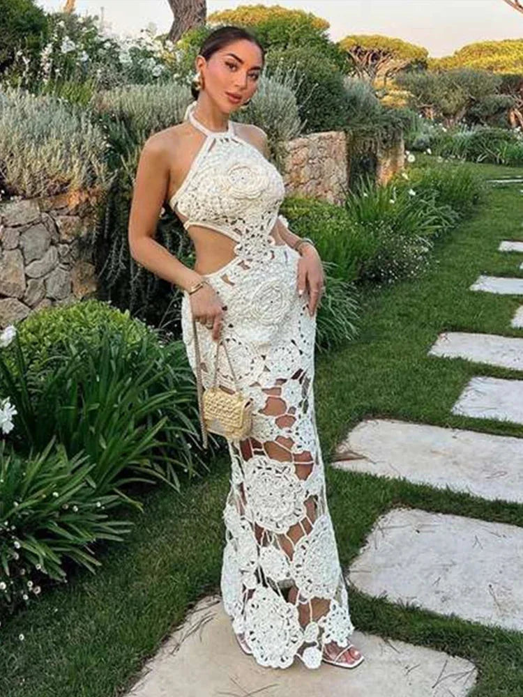 White crochet sleeveless maxi dress by Ellinor, airy and intricate crochet design, perfect for sunny days or beach outings.