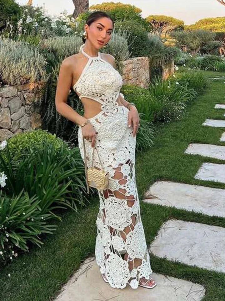 White crochet sleeveless maxi dress by Ellinor, airy and intricate crochet design, perfect for sunny days or beach outings.