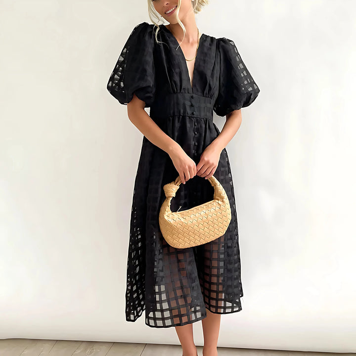 Black textured V-neck midi dress for women by Adrielle with a flattering silhouette and classy design.