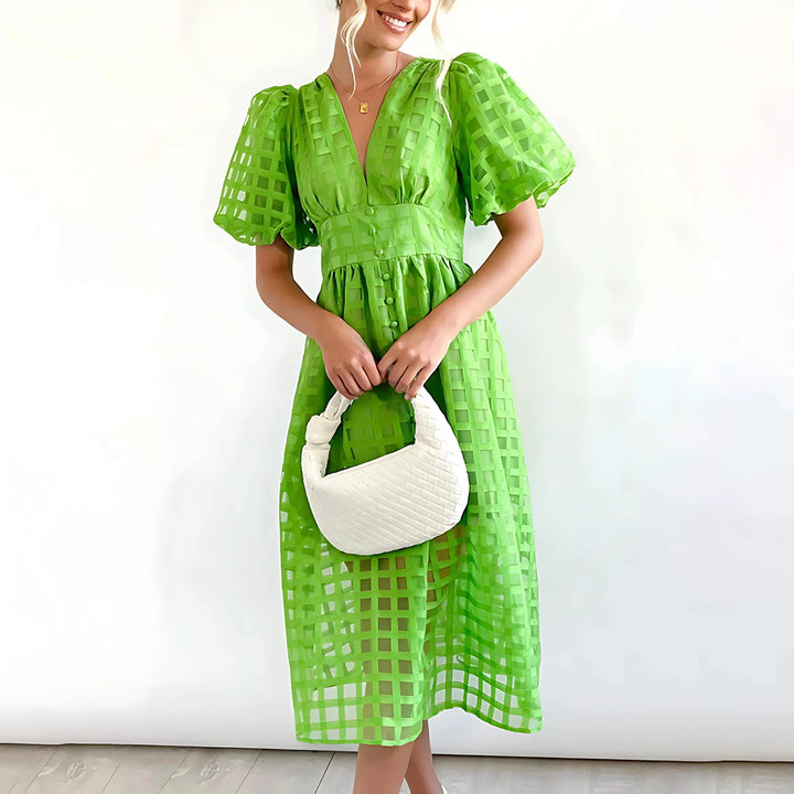 "Green V-neck midi dress in textured fabric for women by Adrielle, perfect for casual outings or special occasions."