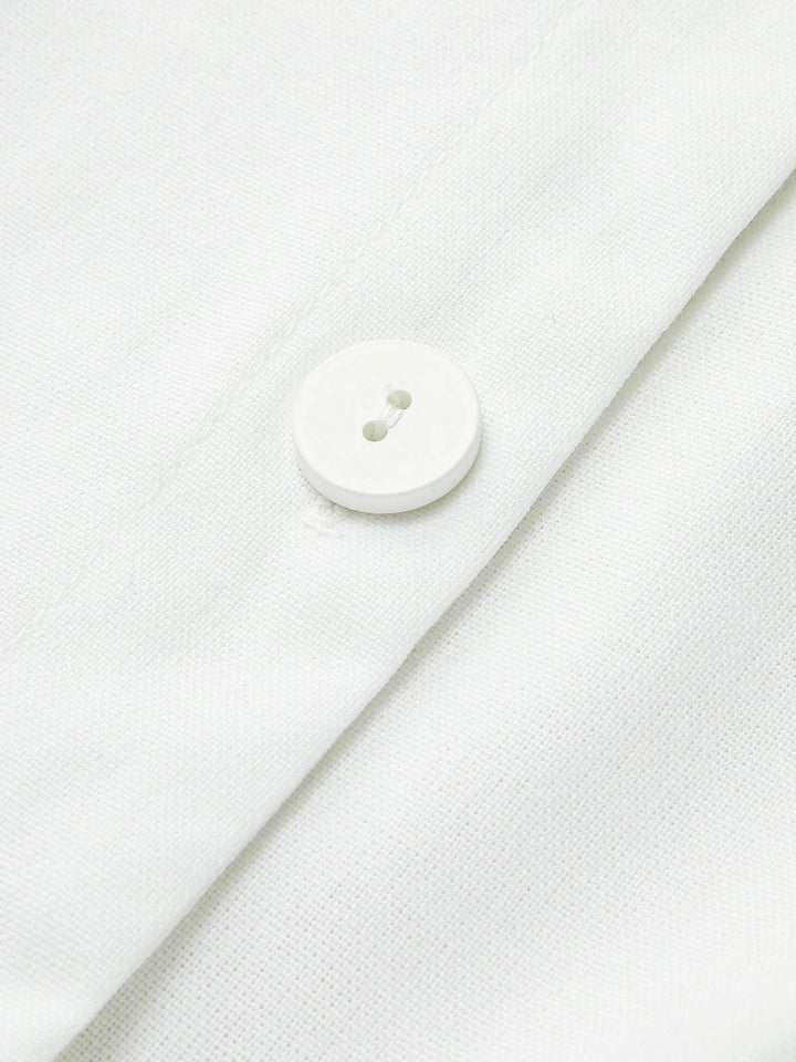 "Sleek sleeveless button-up collared shirt in soft cotton blend with modern design and versatile style by Noemi"