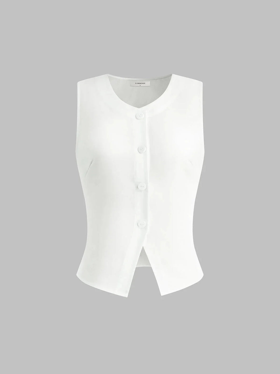 White sleeveless button-up collared shirt by Noemi, featuring a sleek and timeless design perfect for a versatile and…