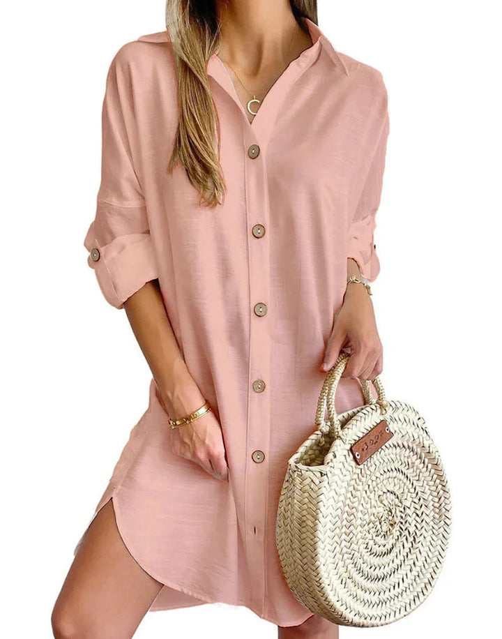 Pink mini dress featuring button details, perfect for a chic look. Cotton blend fabric adds comfort and style to this…