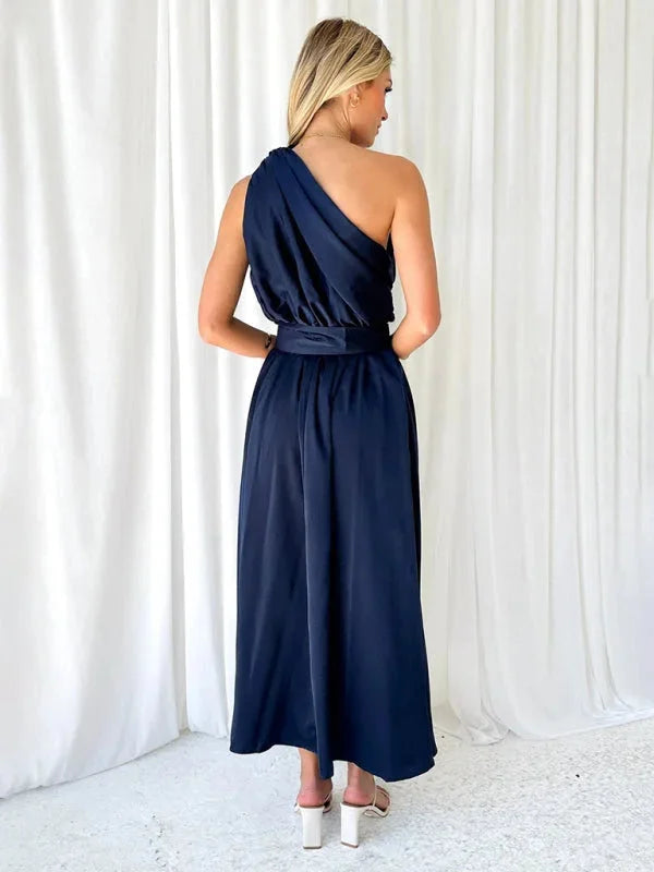"Black one-shoulder maxi dress with belt, softly flowing design, perfect for everyday wear or special occasions from Maelyn."