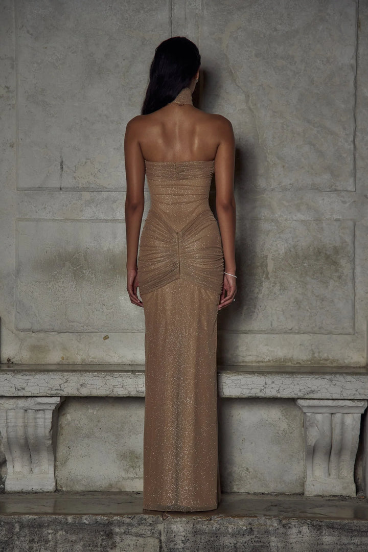 "Beige strapless maxi dress with sparkling embellishments, perfect for special occasions, elegant and stylish."