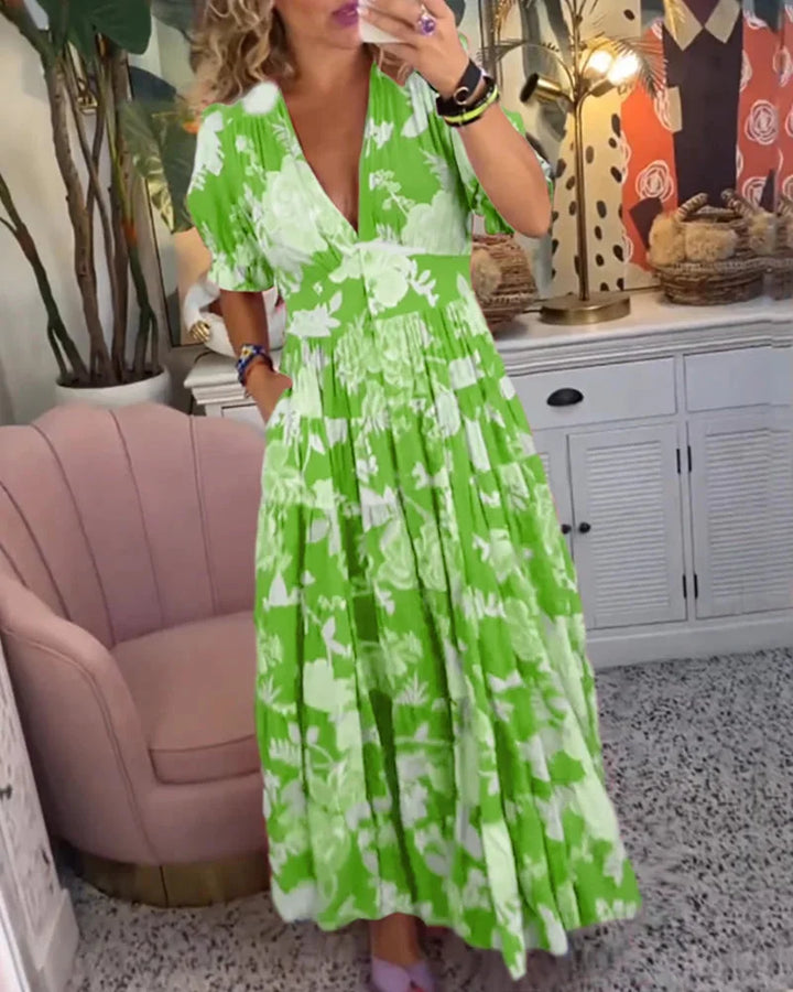 "Maja midi dress in floral print with V-neck and flowy skirt, ideal for casual outings. Made from soft and lightweight…