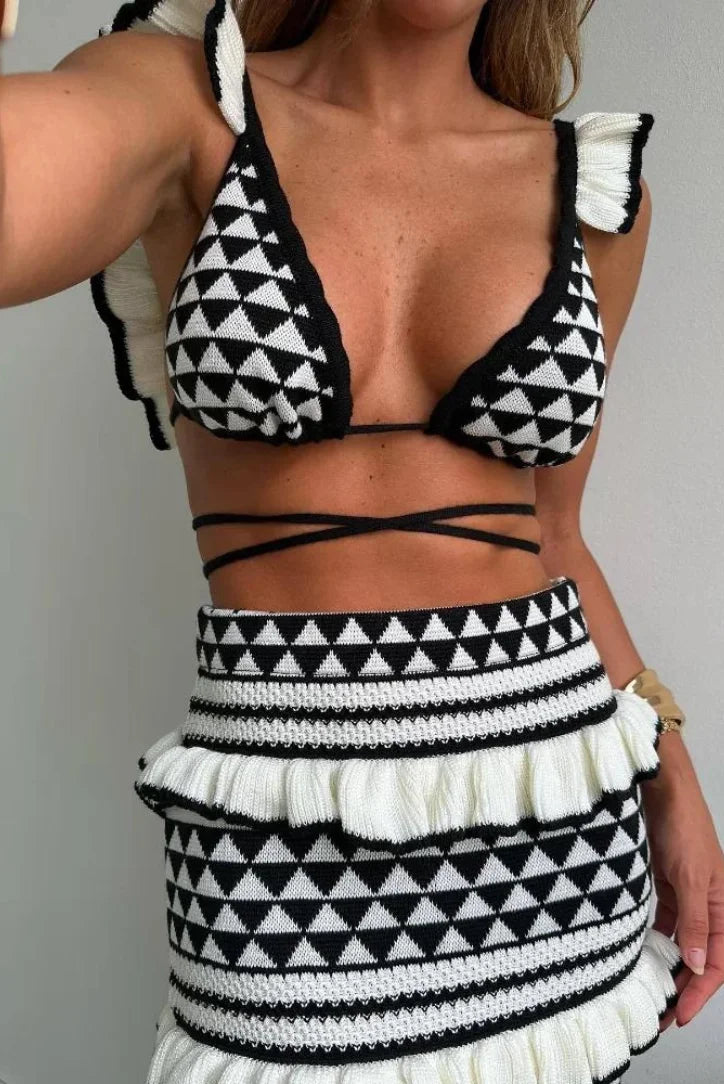 Black and white geometric two-piece skirt set by Asteria showcasing a modern and stylish design with a unique pattern.