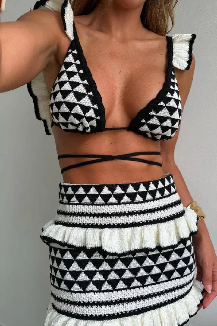 Black and white geometric two-piece skirt set by Asteria showcasing a modern and stylish design with a unique pattern.